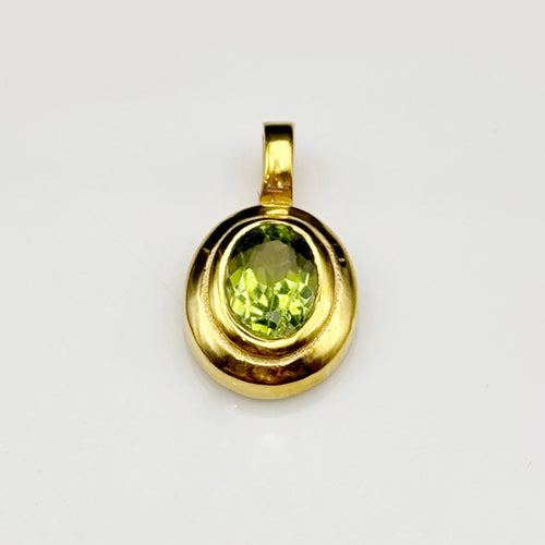 Handmade brass pendant with faceted oval peridot gemstone, August birthstone jewellery