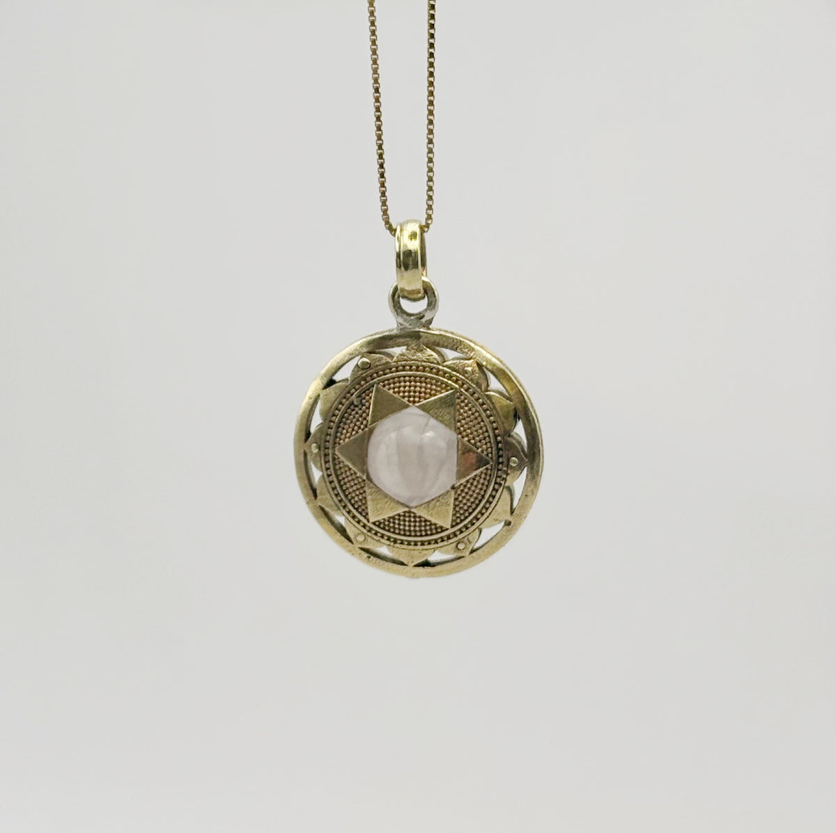 Brass heart chakra pendant with rose quartz crystal, 20 mm diameter, handmade spiritual jewellery