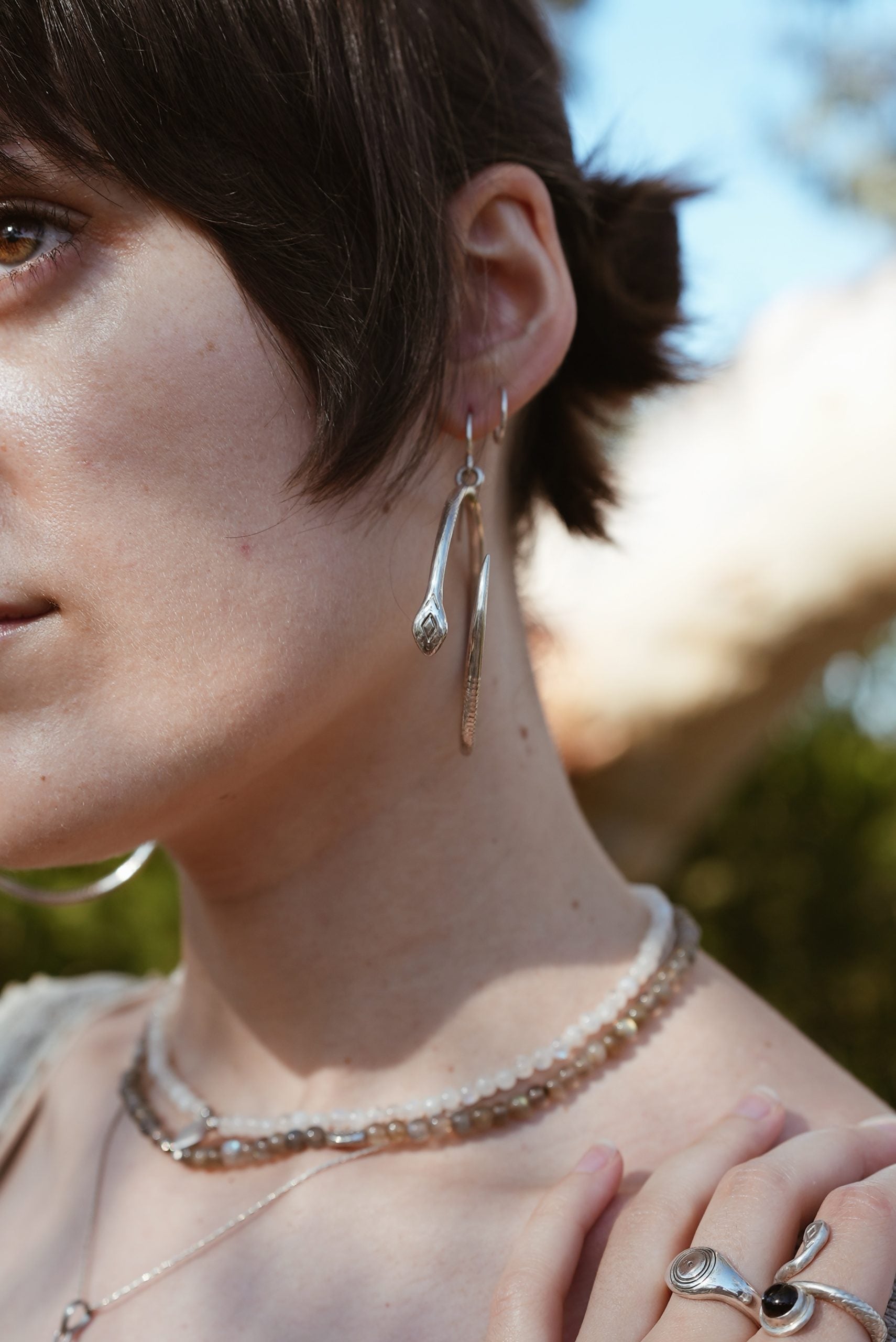 Hoop silver earring snake jewellery on the model