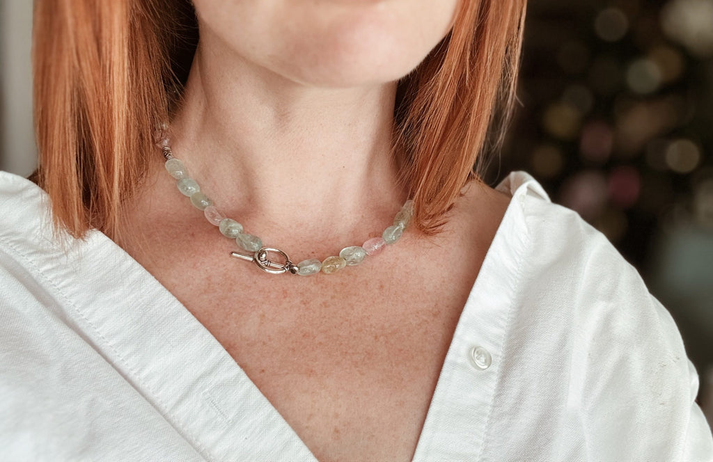 Full length view of the aquamarine necklace showing the gradient of the blue gemstone beads