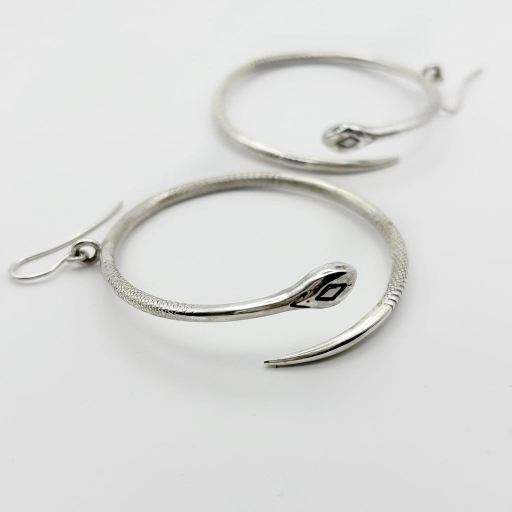 Detail view of the secure sterling silver hooks and the solid back of the earrings